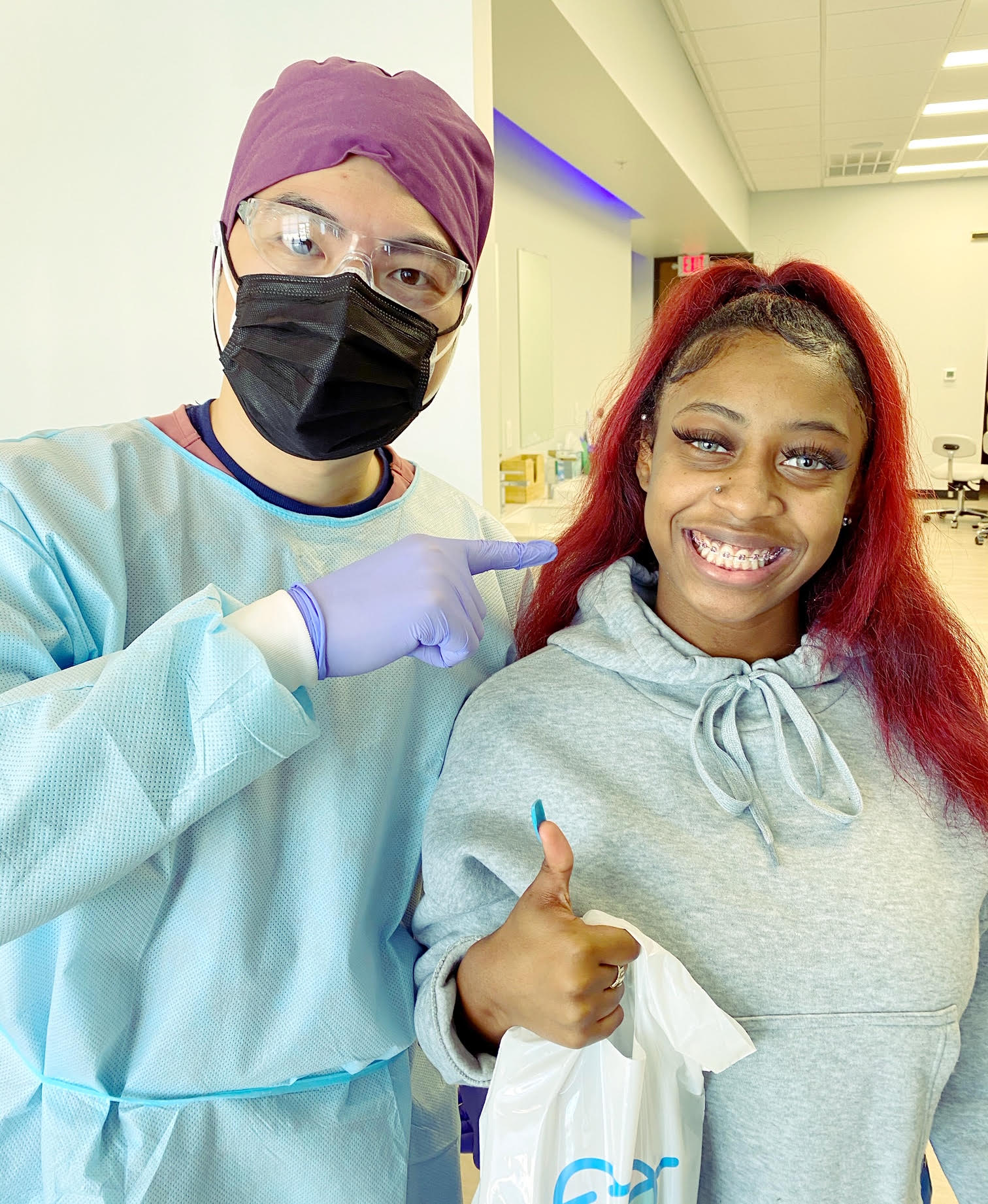 Photo of a Missouri City orthodontist with a patient